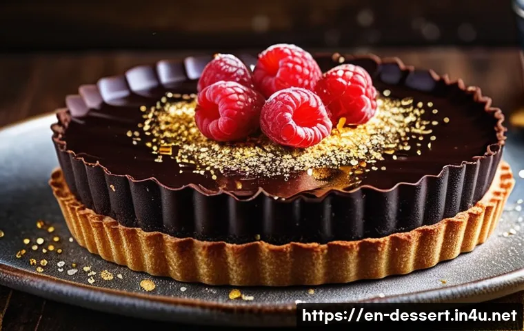 초콜릿 디저트 - A luxurious chocolate tart with a glossy, tempered dark chocolate ganache topping, sprinkled delicat...